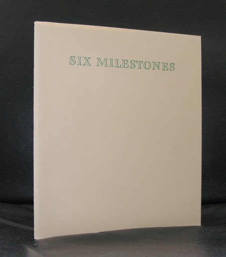 A beige book cover featuring the title 'SIX MILESTONES' in green lettering.