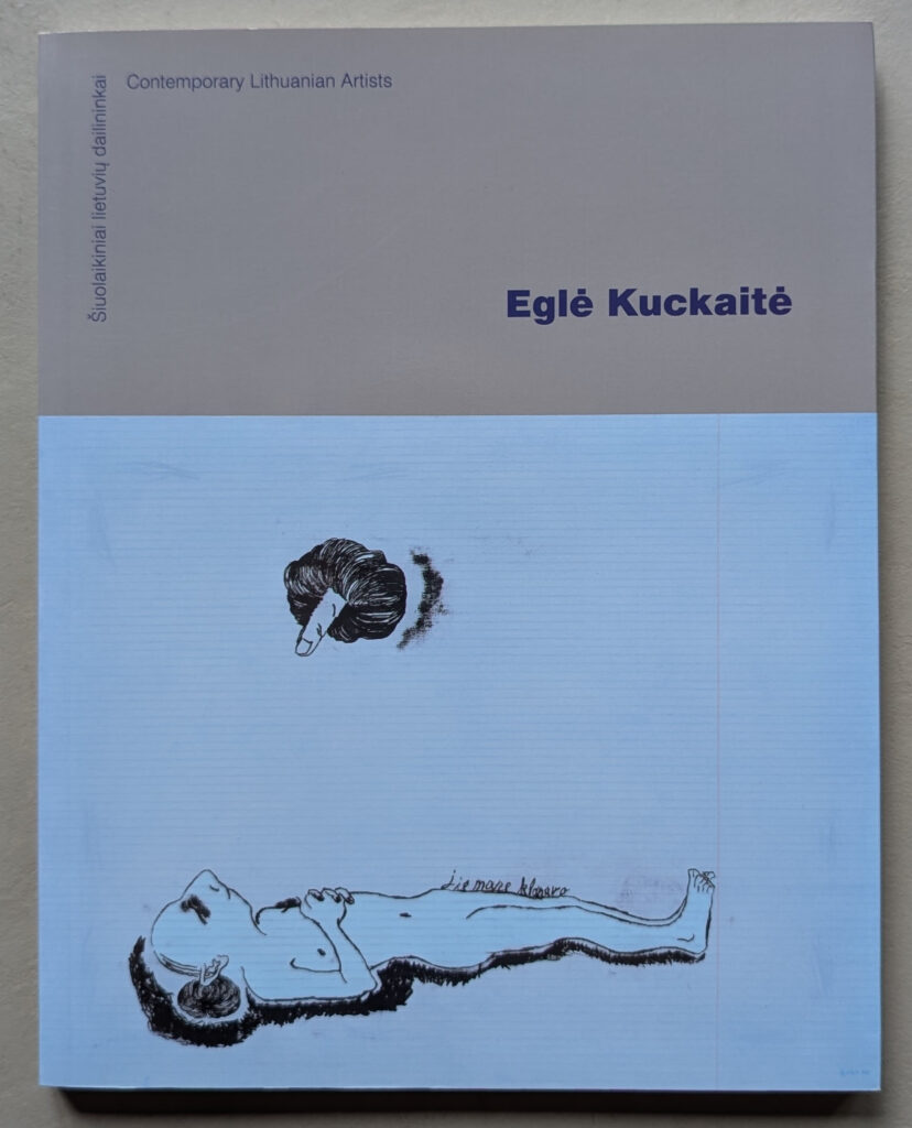 Book cover featuring the title 'Eglė Kuckaitė' and an illustration of a figure lying down with a hand reaching from above.