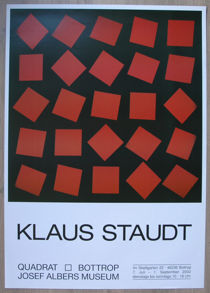 Poster for Klaus Staudt exhibition at Josef Albers Museum featuring a geometric design with red and orange squares on a black background.