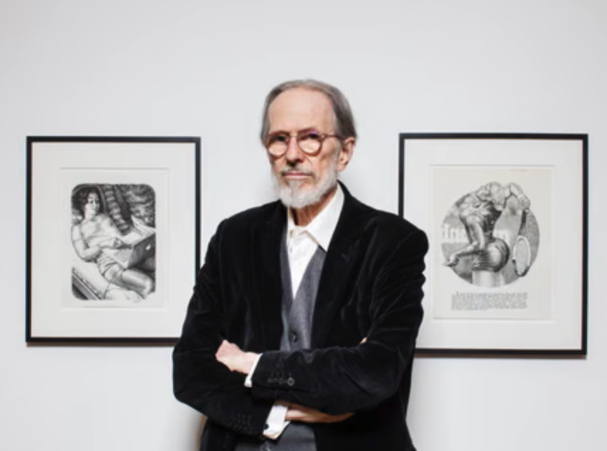 A man with gray hair and glasses stands with crossed arms in front of two framed artworks on the wall.