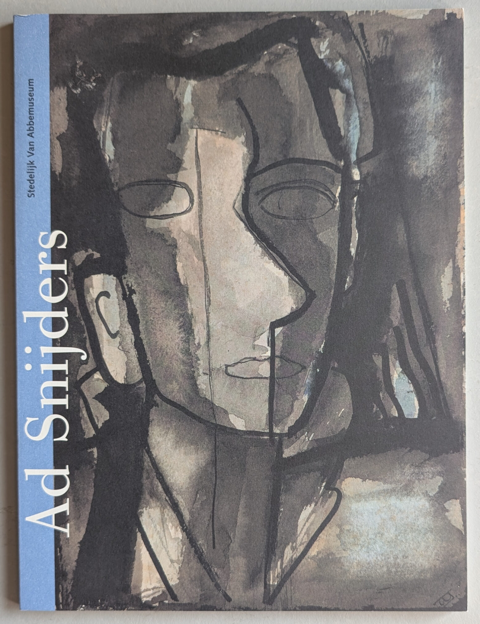 A book cover featuring abstract artwork by Ad Snijders, showcasing dark and muted colors with a stylized face illustration.