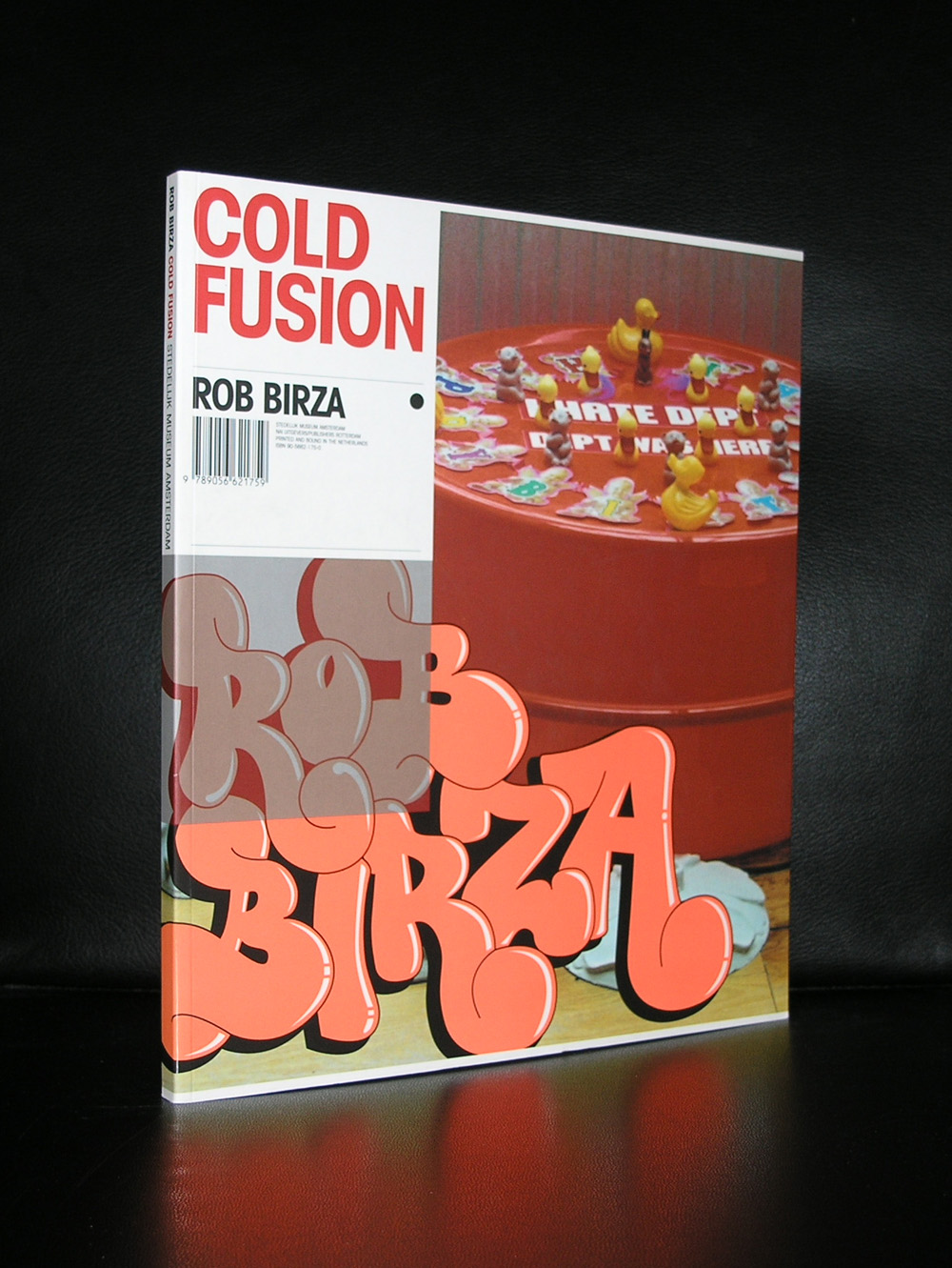 Book cover for 'Cold Fusion' by Rob Birza, featuring colorful text and an image of a playful table scene with rubber toys.