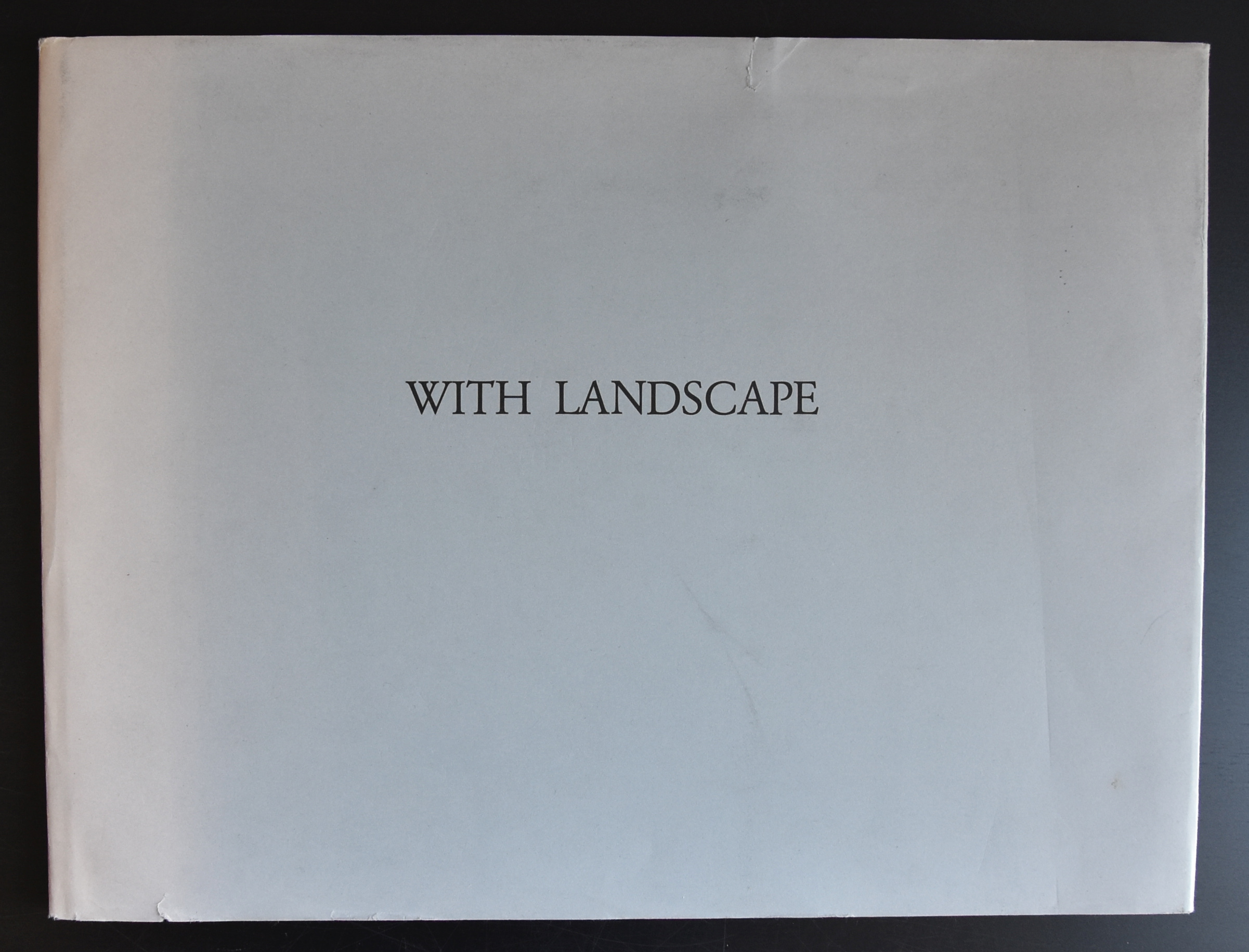 Cover of a book titled 'WITH LANDSCAPE' featuring simple typography on a plain background.