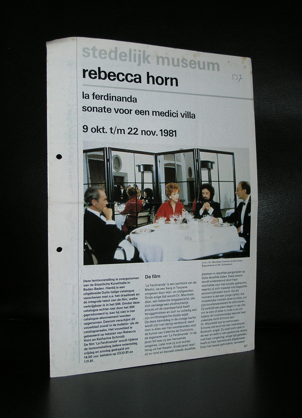 A promotional flyer for a Rebecca Horn exhibition at the Stedelijk Museum, featuring a photograph of four people dining at a table with mirrors in the background.