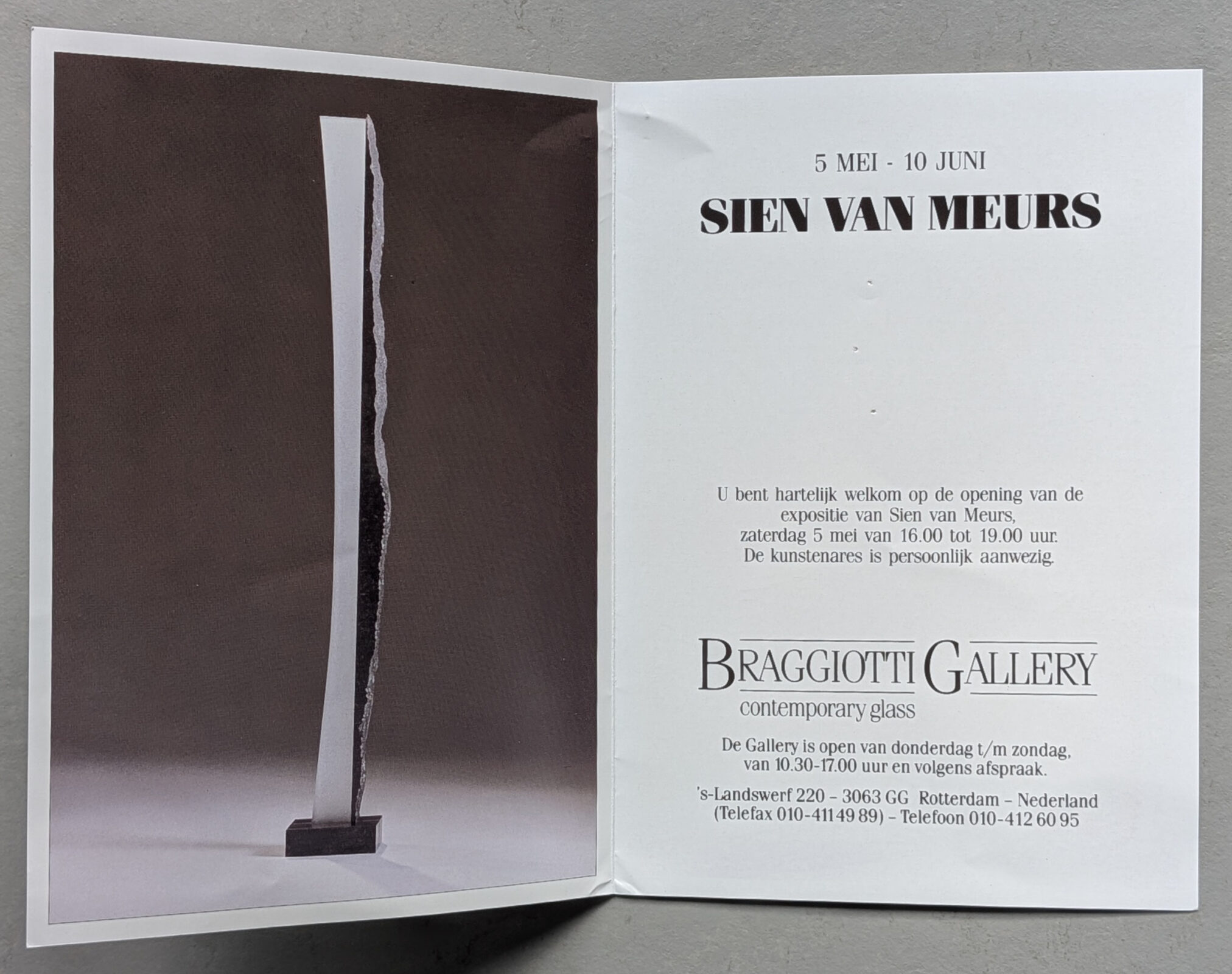 A folded exhibition pamphlet for Sien van Meurs, showcasing a tall glass sculpture with a textured stone base. It features details about the exhibition dates and the gallery location.