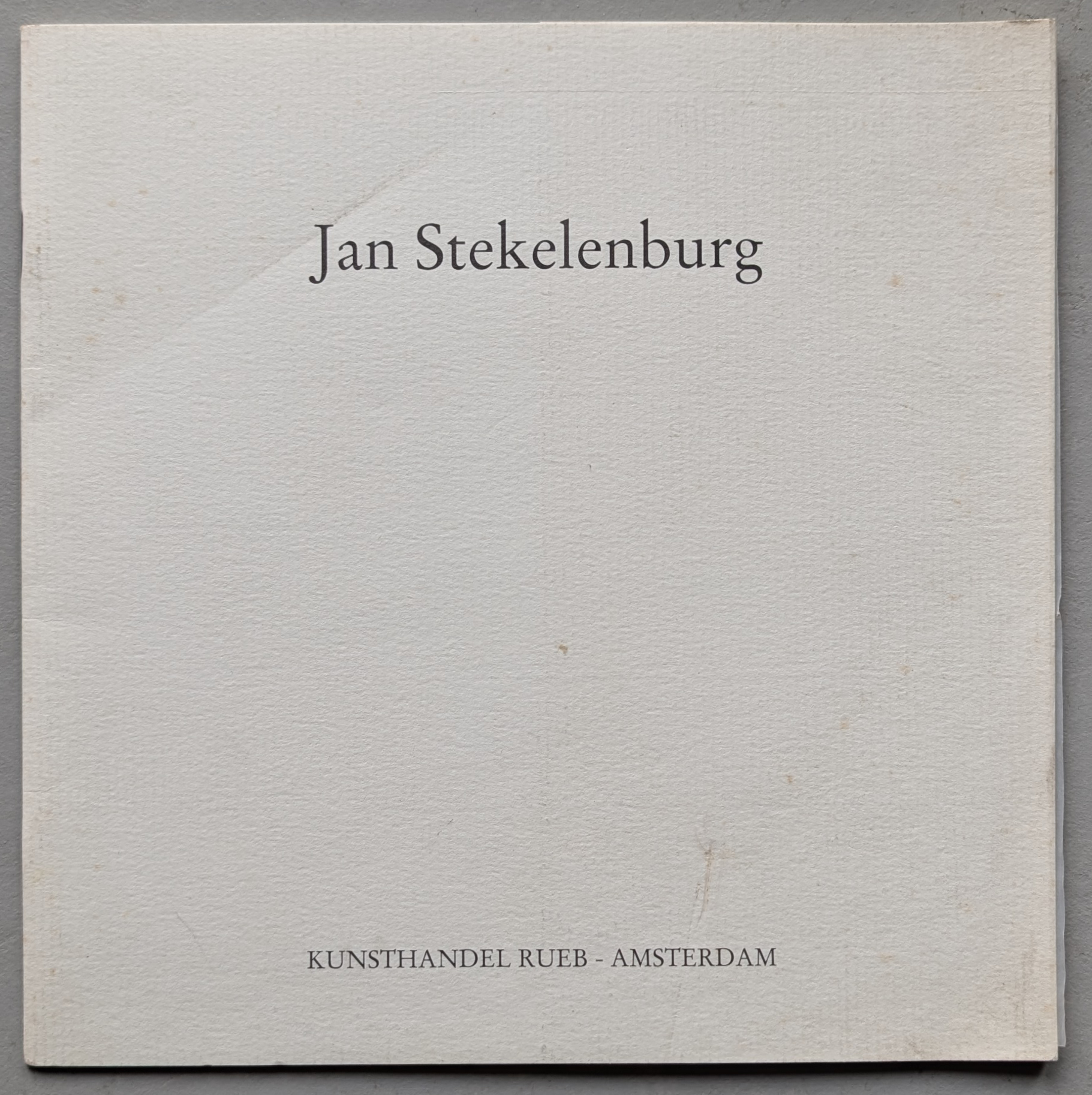 Cover of a publication featuring the name 'Jan Stekelenburg' with the text 'KUNSTHANDEL RUEB - AMSTERDAM' at the bottom.