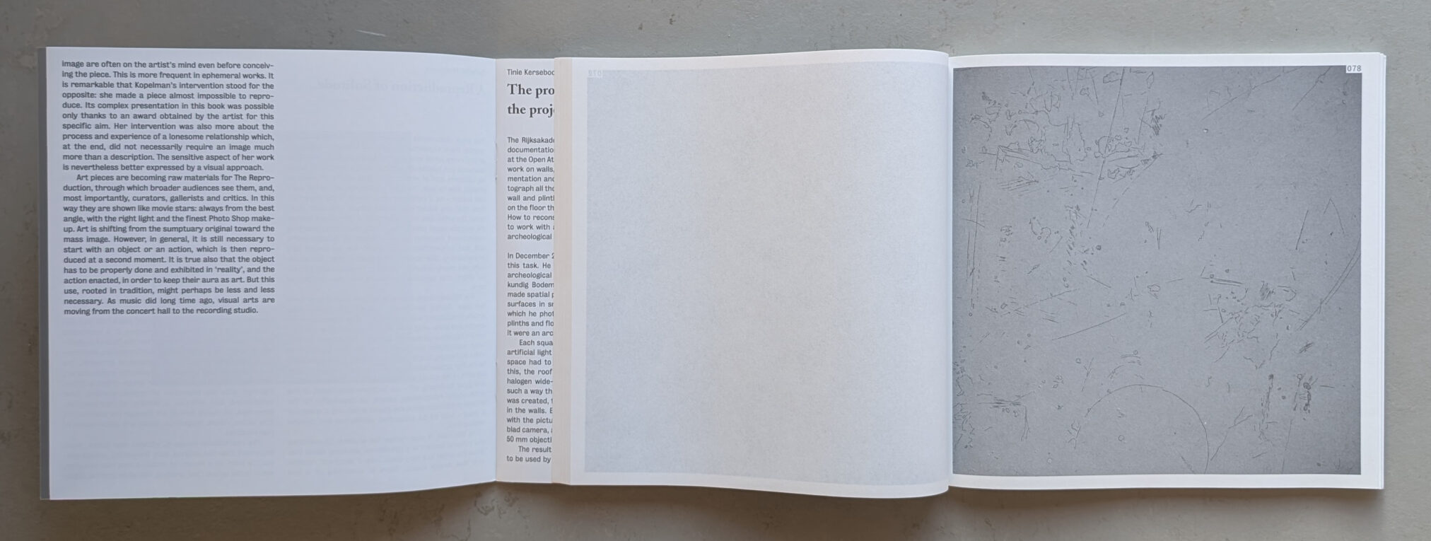 An open book displaying two pages with text and an abstract image, highlighting the interplay between art and its documentation.