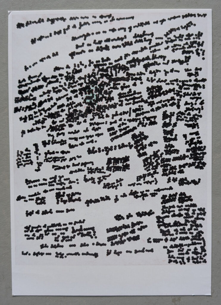 A page filled with densely packed, handwritten text and scribbles, creating an abstract visual appearance.